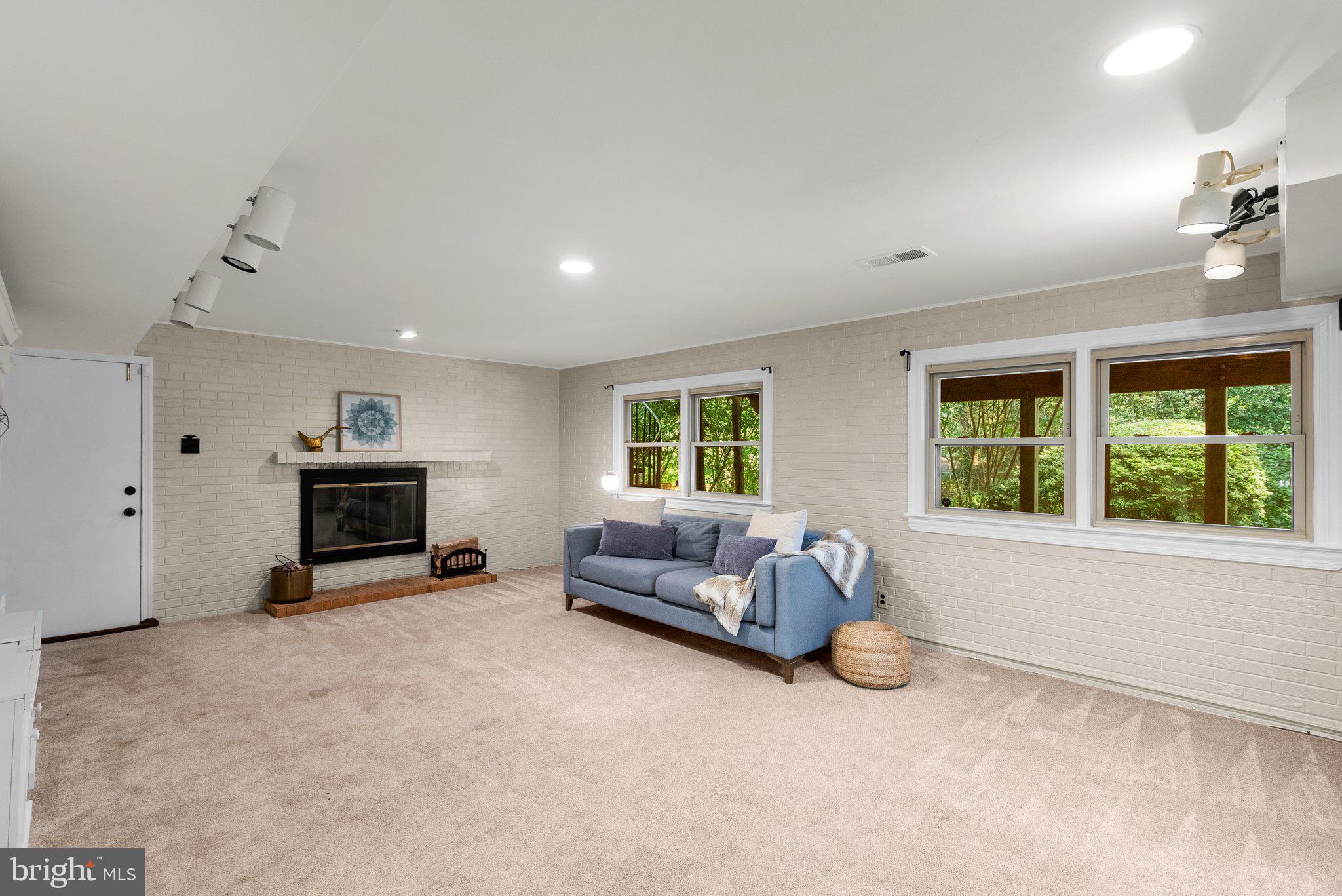 200 Eldrid Drive Silver Spring, MD 20904 - Photo 16 of 44 a living room with furniture and a fireplace