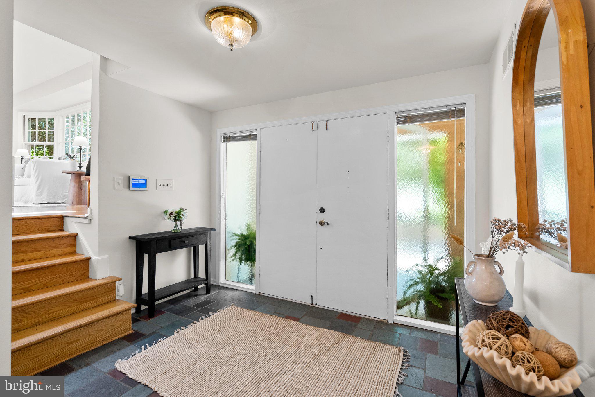 200 Eldrid Drive Silver Spring, MD 20904 - Photo 4 of 44 a living room with furniture and a potted plant