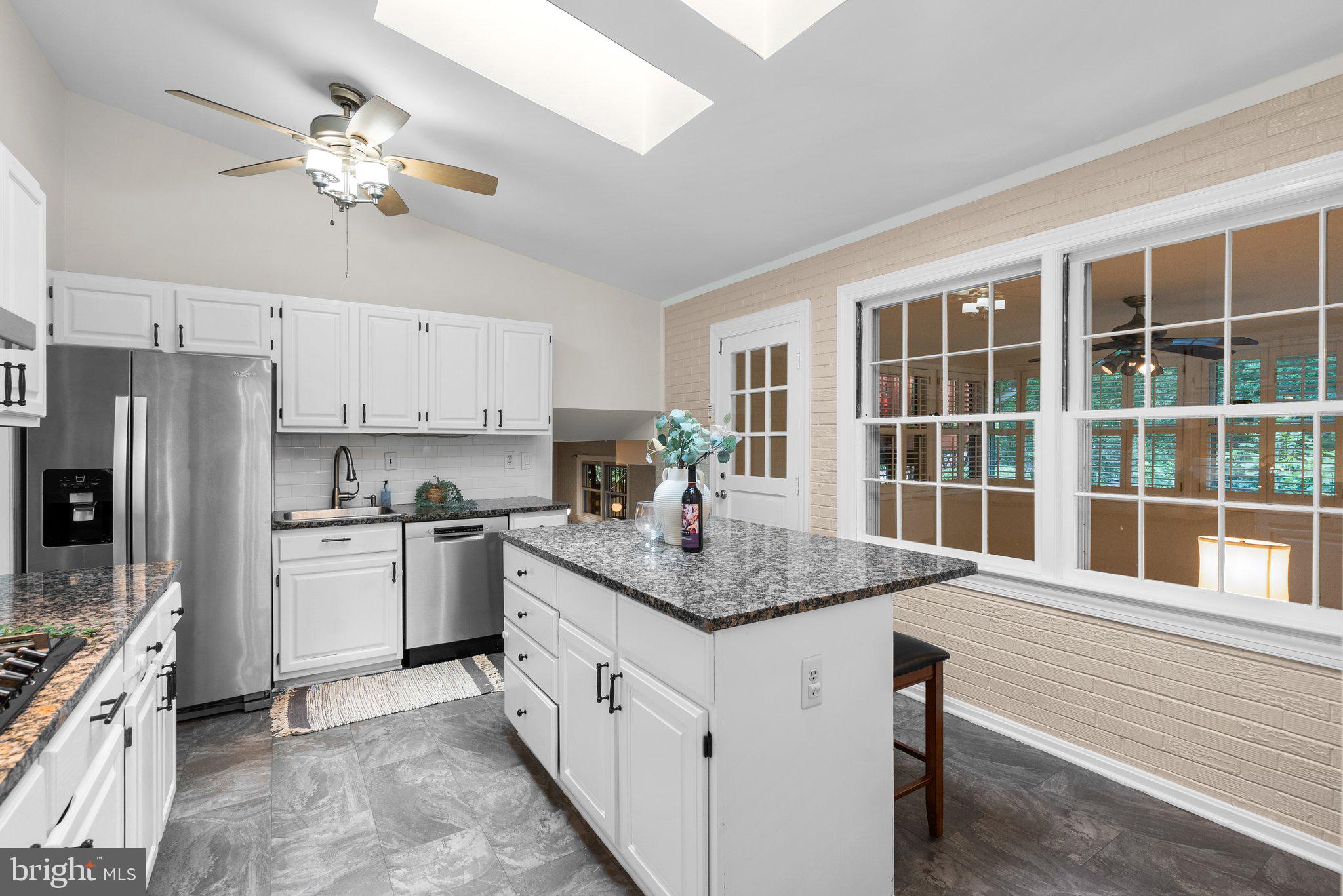 200 Eldrid Drive Silver Spring, MD 20904 - Photo 10 of 44 a kitchen with stainless steel appliances granite countertop a sink dishwasher stove and refrigerator