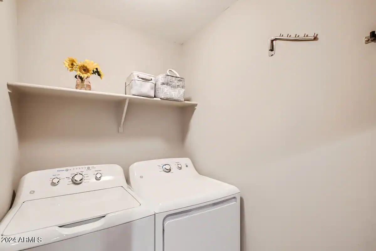 6900 East Princess Drive, Unit 2111 Phoenix, AZ 85054 - Photo 13 of 18 a utility room with dryer and washer