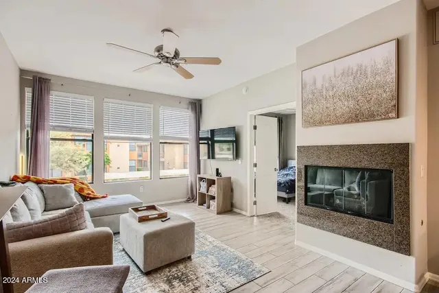 a living room with furniture and a fireplace