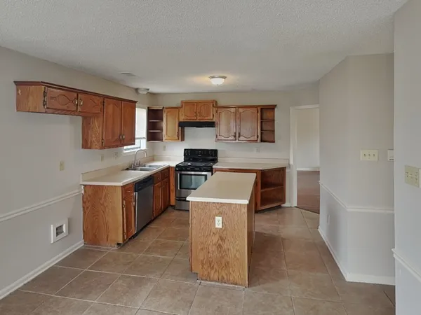 a kitchen with a cabinets and a counter top space