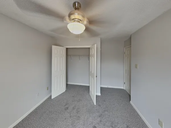 a view of an empty room and a window
