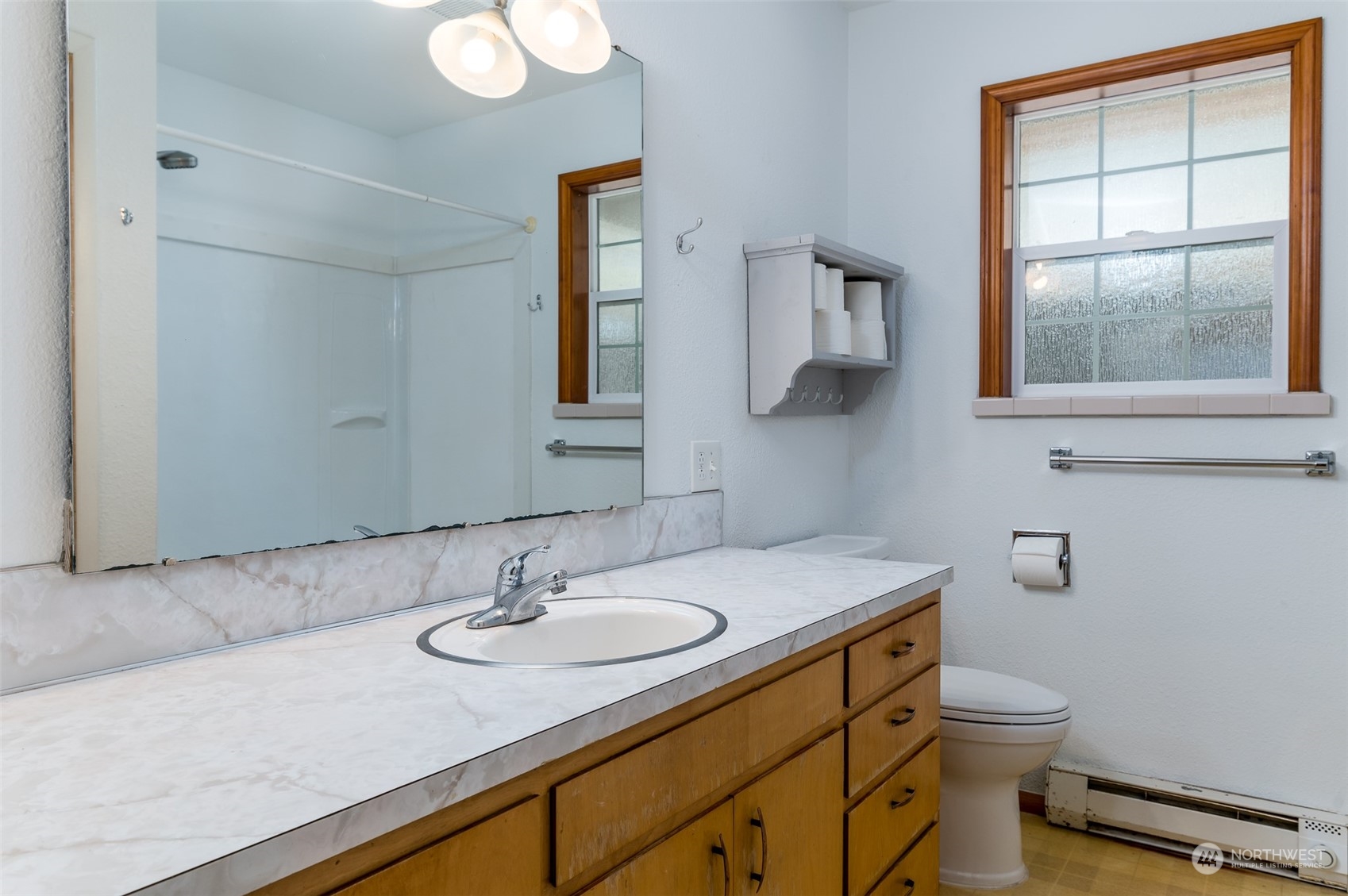 6912 Old Guide Road Lynden, WA 98264 - Photo 12 of 37 a bathroom with a granite countertop sink toilet and mirror