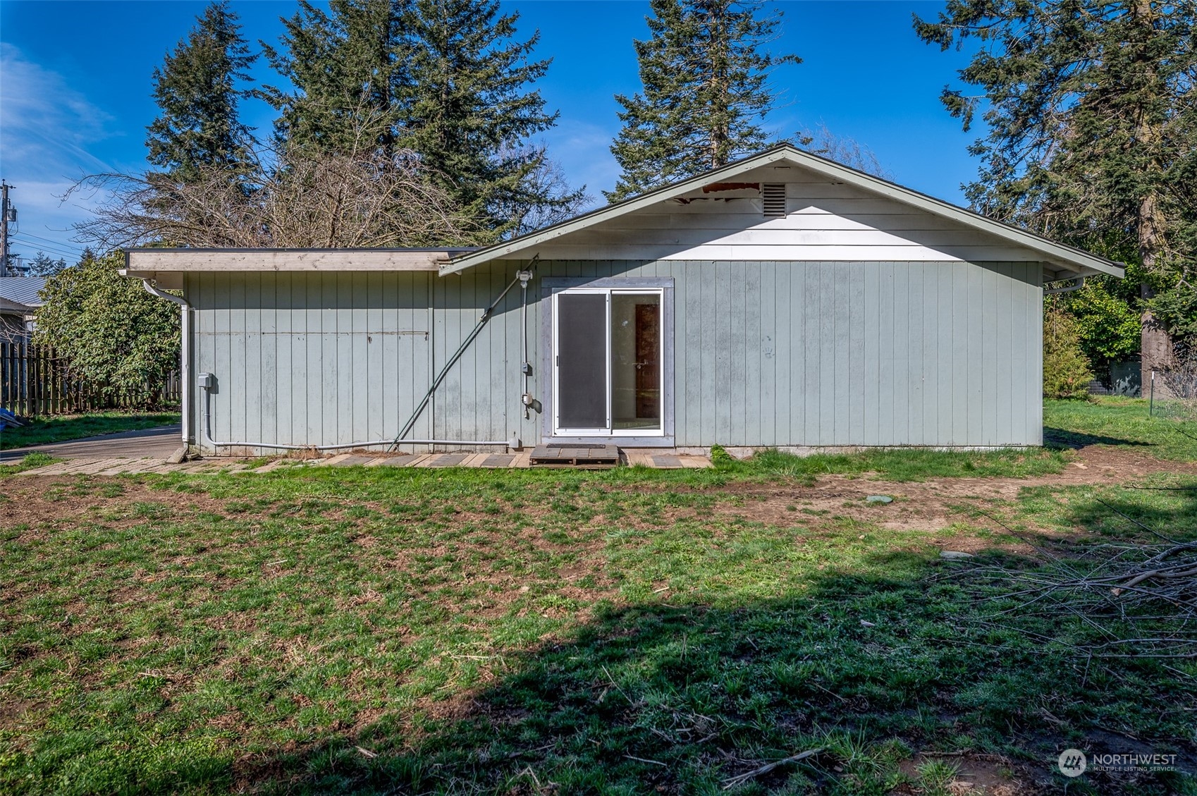 6912 Old Guide Road Lynden, WA 98264 - Photo 23 of 37 a house with green field in front of it