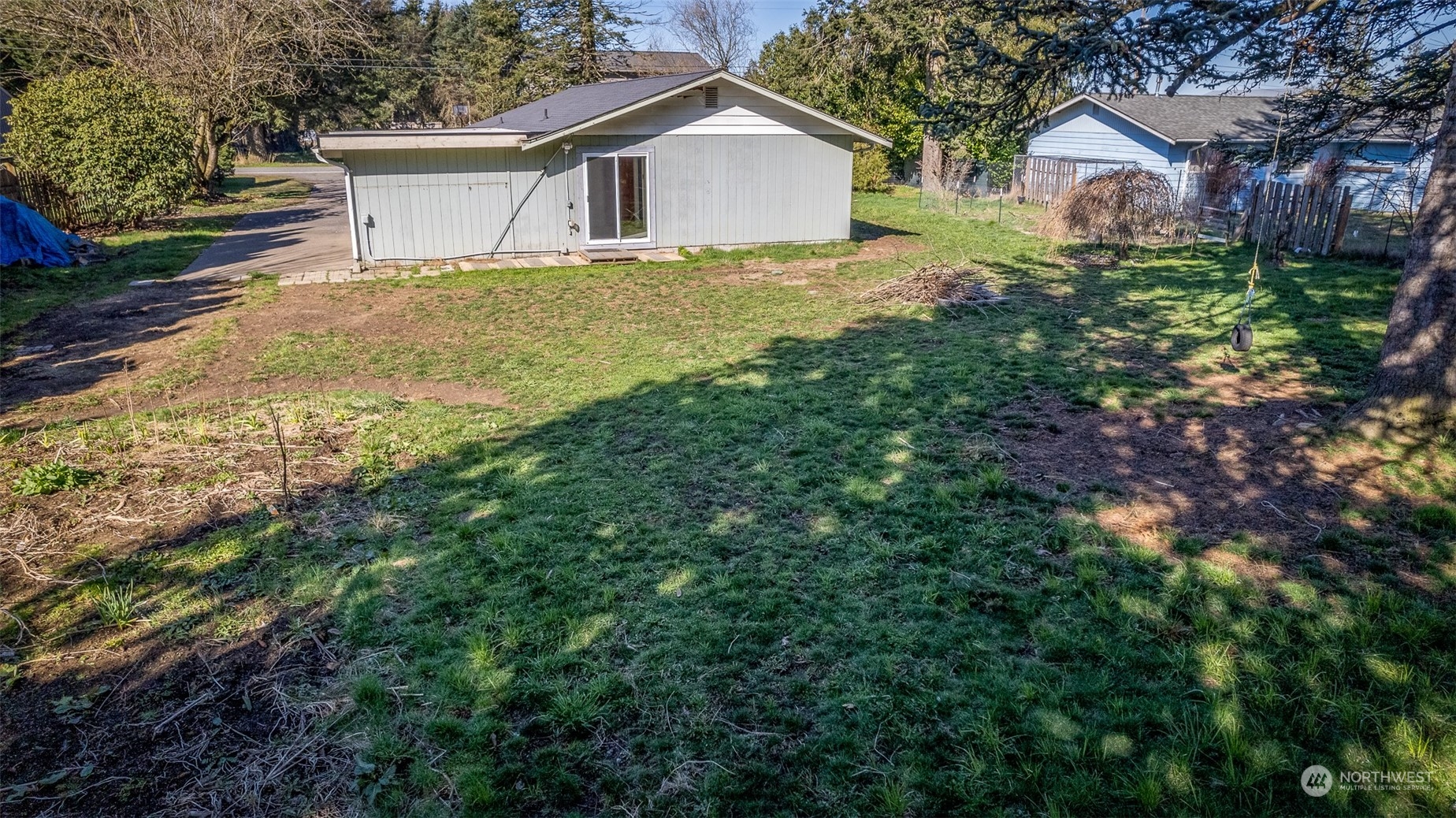 6912 Old Guide Road Lynden, WA 98264 - Photo 33 of 37 a white house sitting in middle of the forest