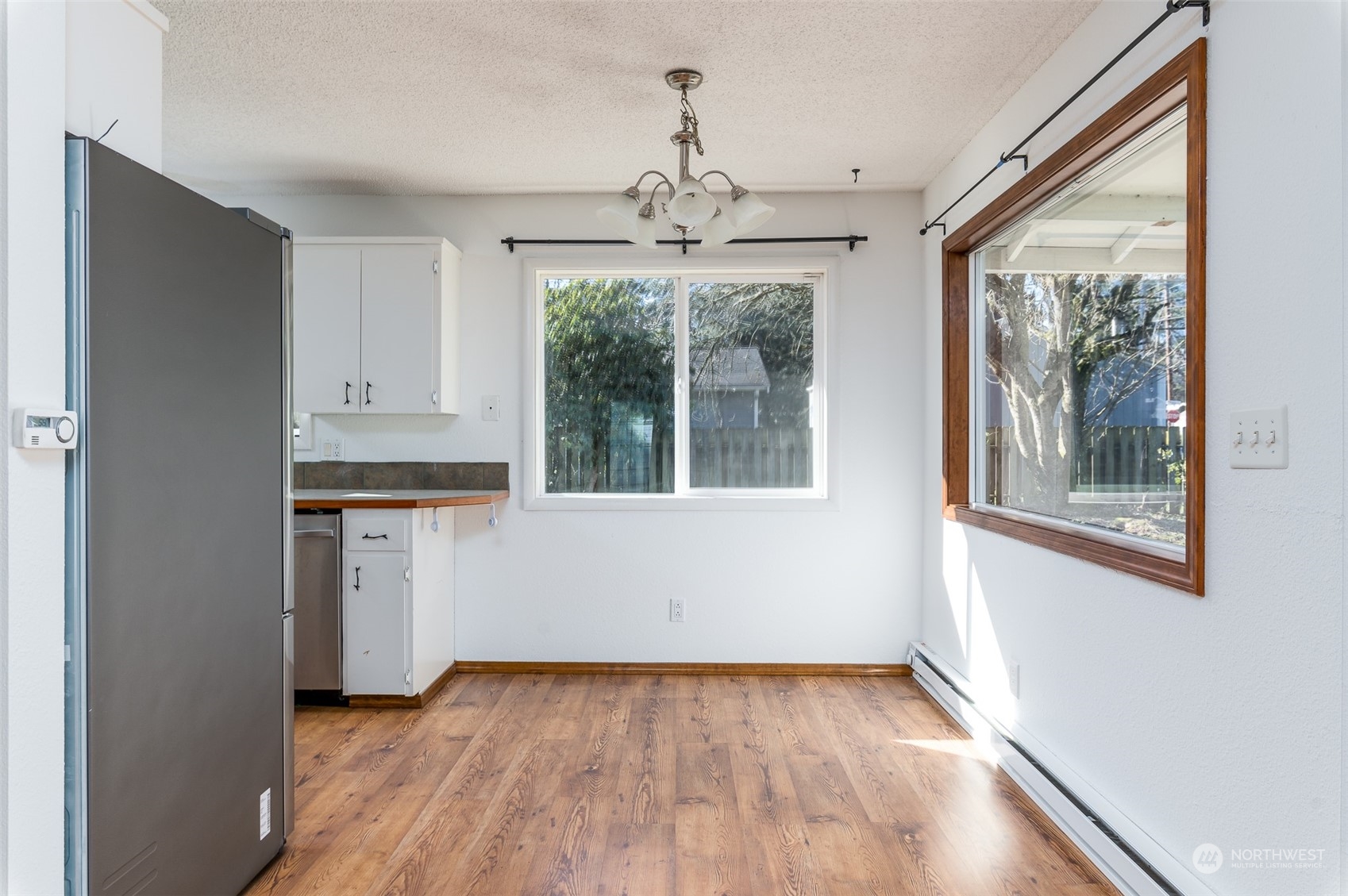 6912 Old Guide Road Lynden, WA 98264 - Photo 6 of 37 a view of an empty room with a window and wooden floor