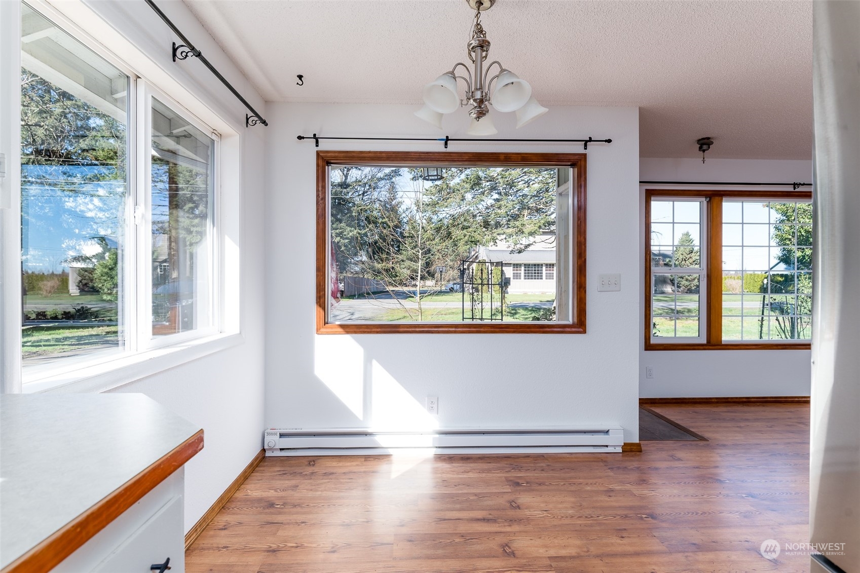 6912 Old Guide Road Lynden, WA 98264 - Photo 9 of 37 a view of an empty room with wooden floor and a window