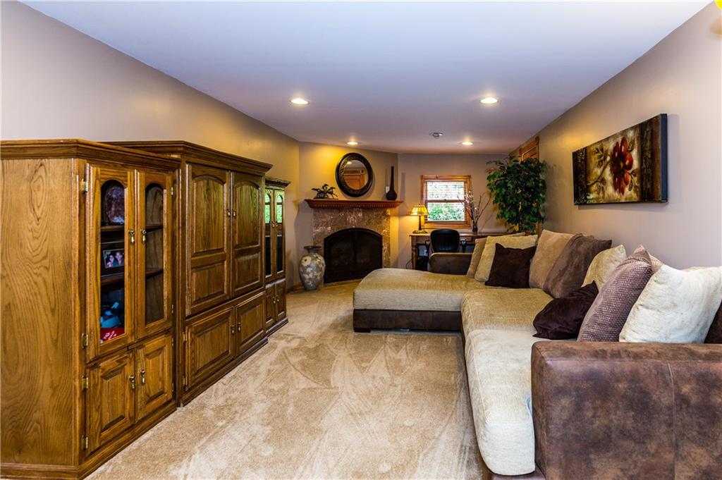 154 Chevy Lane Rochester, PA 15074 - Photo 18 of 25 Game Room with fireplace and generous 20' storage closet