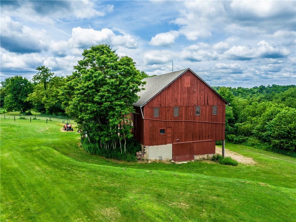 154 Chevy Lane Rochester, PA 15074 - Photo 21 of 25 Magnificent bank barn exceeds 40' x 60' in size. Newer stalls with rubber mats, bountiful hay loft with tremendous space for extra storage, and even an "secret" playhouse on the third level.