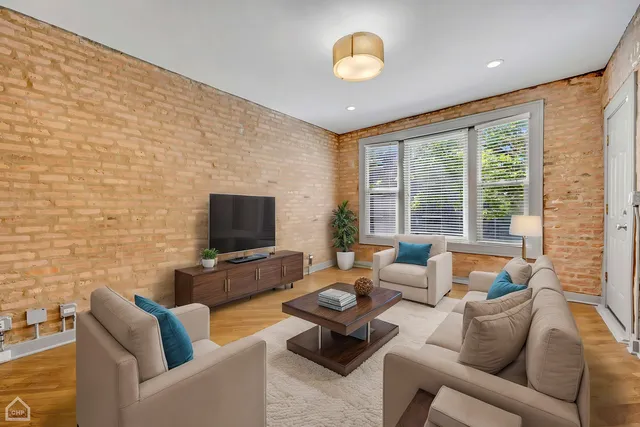 a living room with furniture and a table