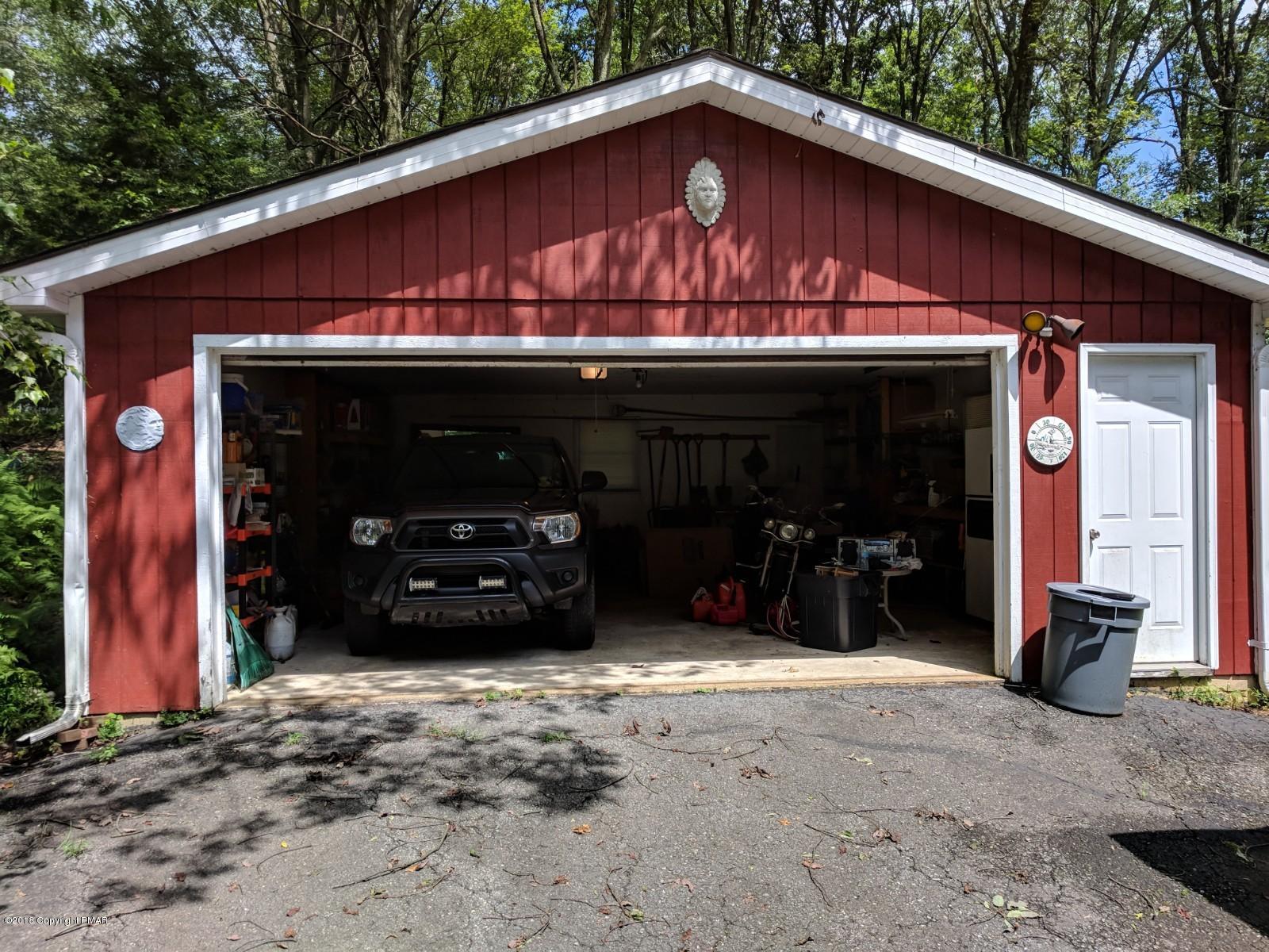 1109 Bracts Road Effort, PA 18330 - Photo 22 of 31 a view of a house with a patio and a garage