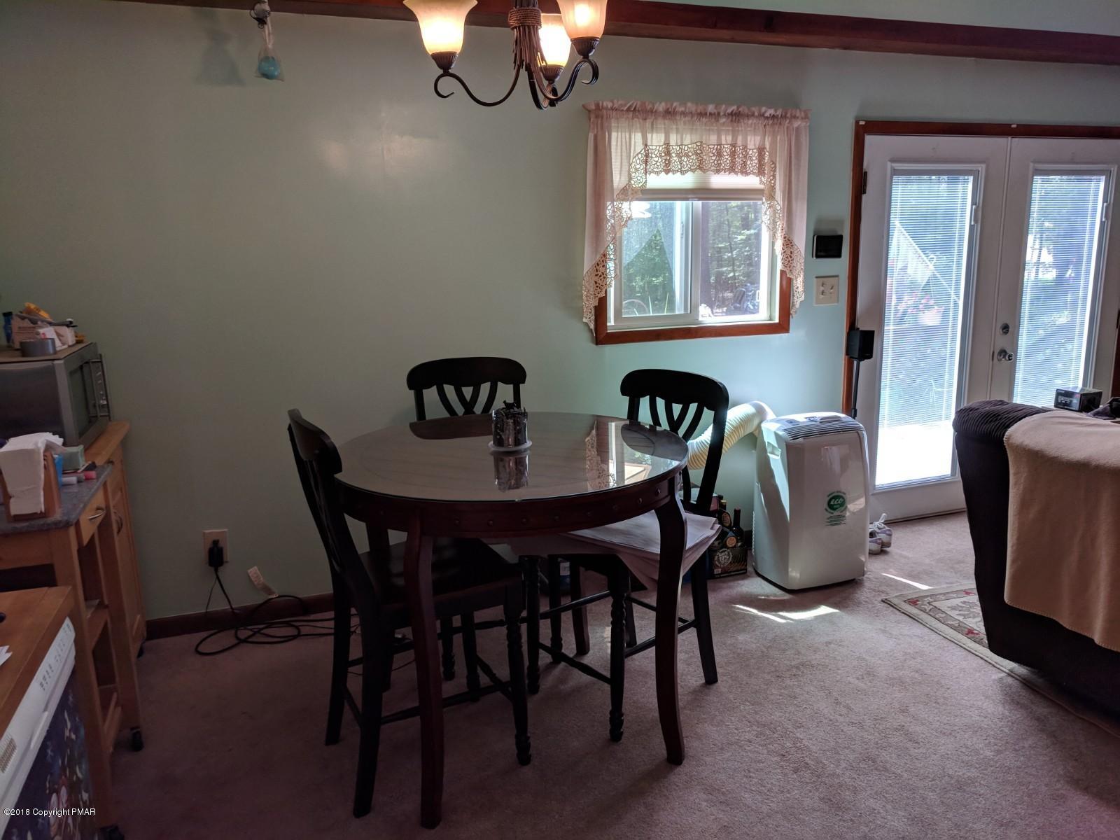 1109 Bracts Road Effort, PA 18330 - Photo 8 of 31 a view of a dining room with furniture and window