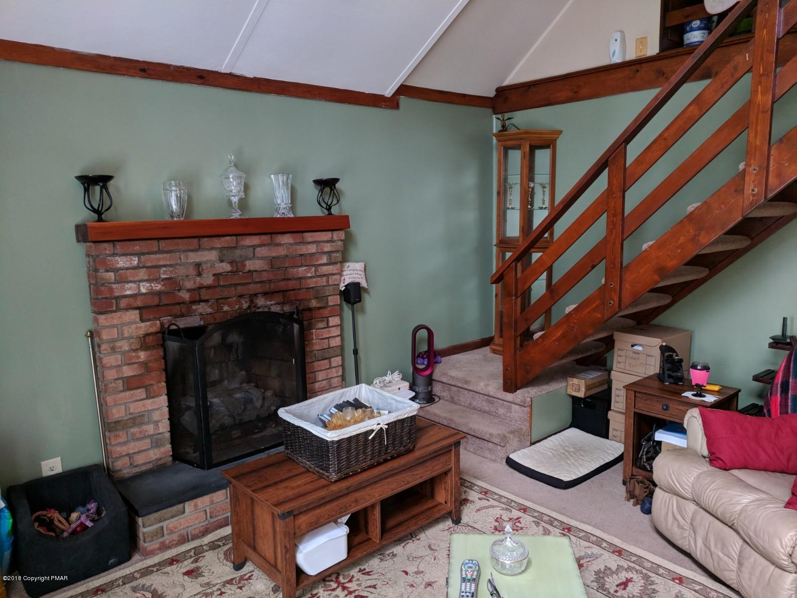 1109 Bracts Road Effort, PA 18330 - Photo 9 of 31 a living room with furniture and a fireplace