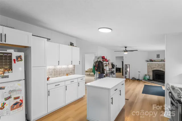 a view of kitchen and sink with cabinets