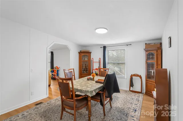 a view of a dining room with furniture and window