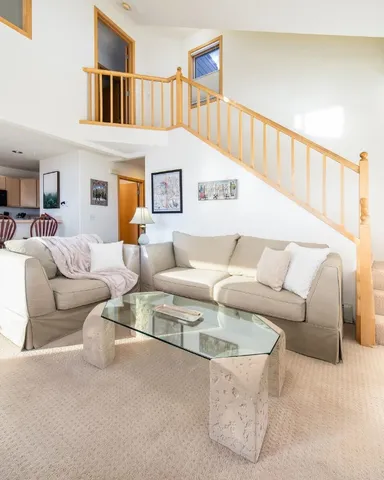 a living room with furniture and a table