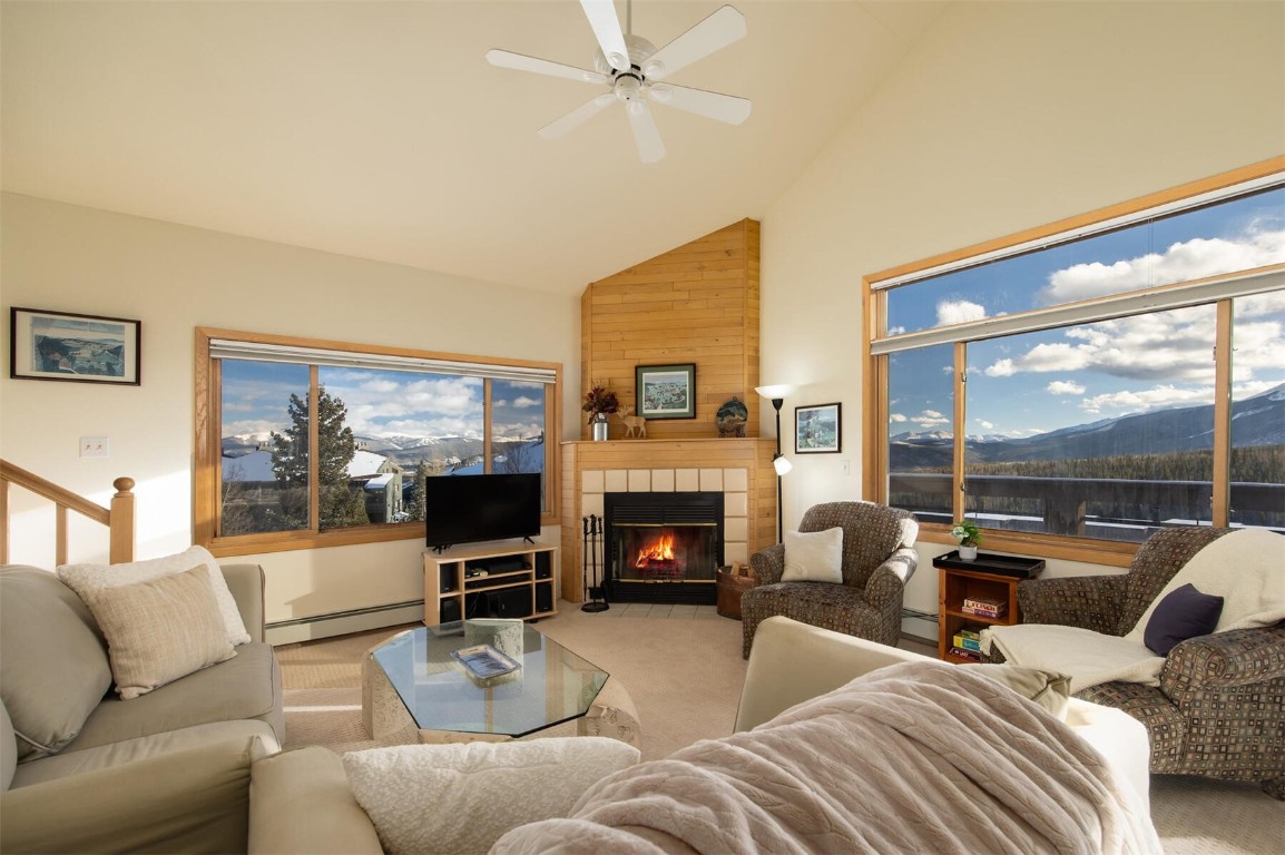 95600 Ryan Gulch Road, Unit 631 Silverthorne, CO 80498 - Photo 2 of 44 a living room with fireplace furniture and a large window