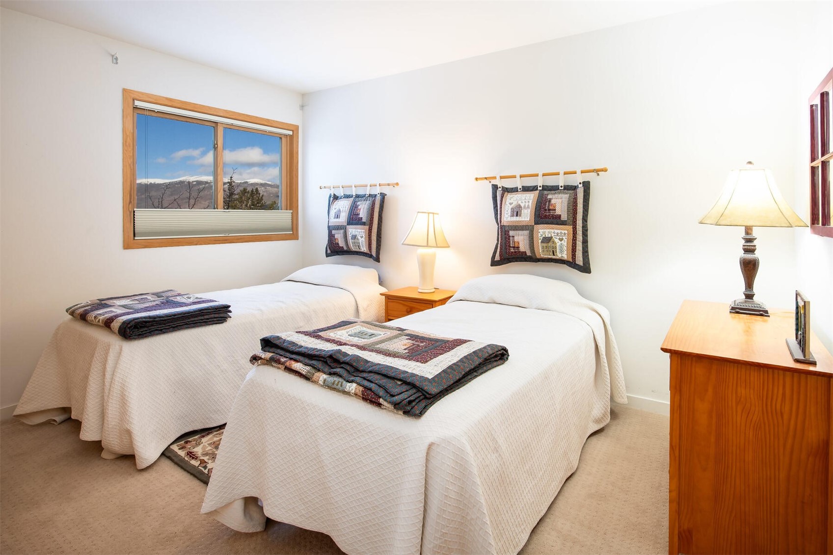 95600 Ryan Gulch Road, Unit 631 Silverthorne, CO 80498 - Photo 23 of 44 a bedroom with a bed and a desk
