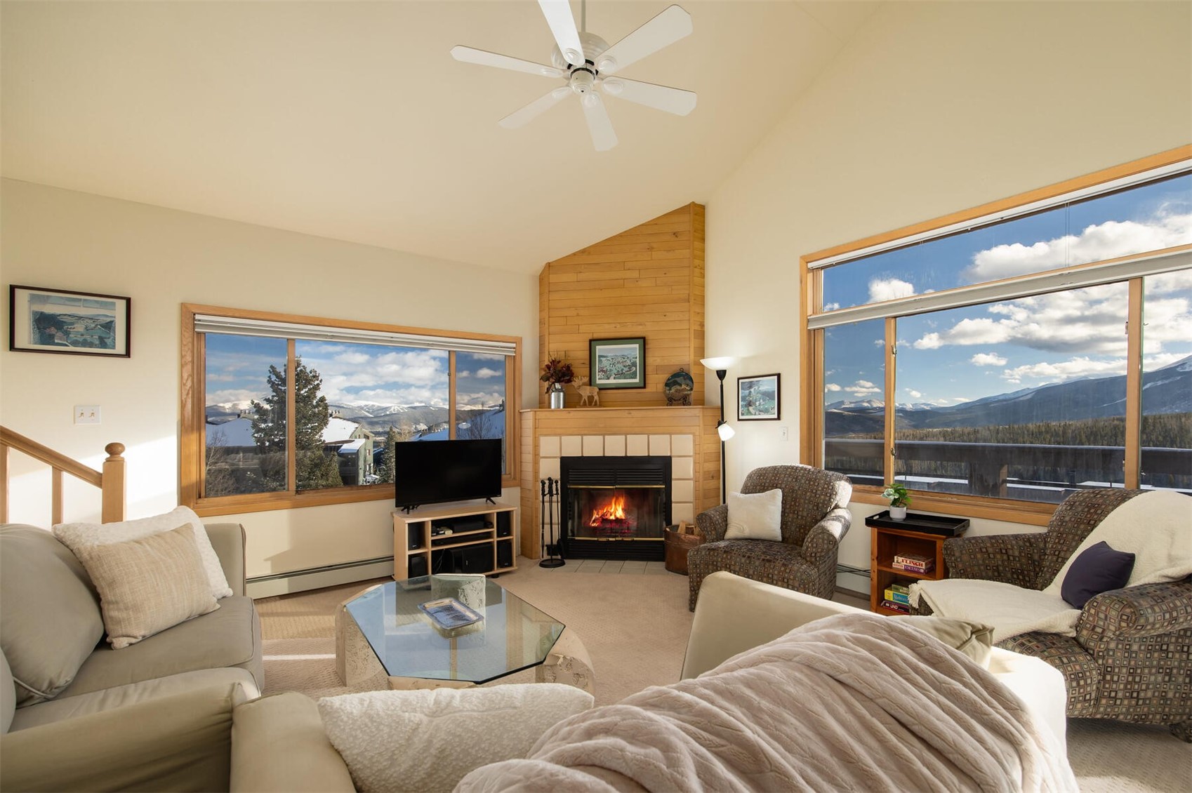 95600 Ryan Gulch Road, Unit 631 Silverthorne, CO 80498 - Photo 3 of 44 a living room with fireplace furniture and a large window
