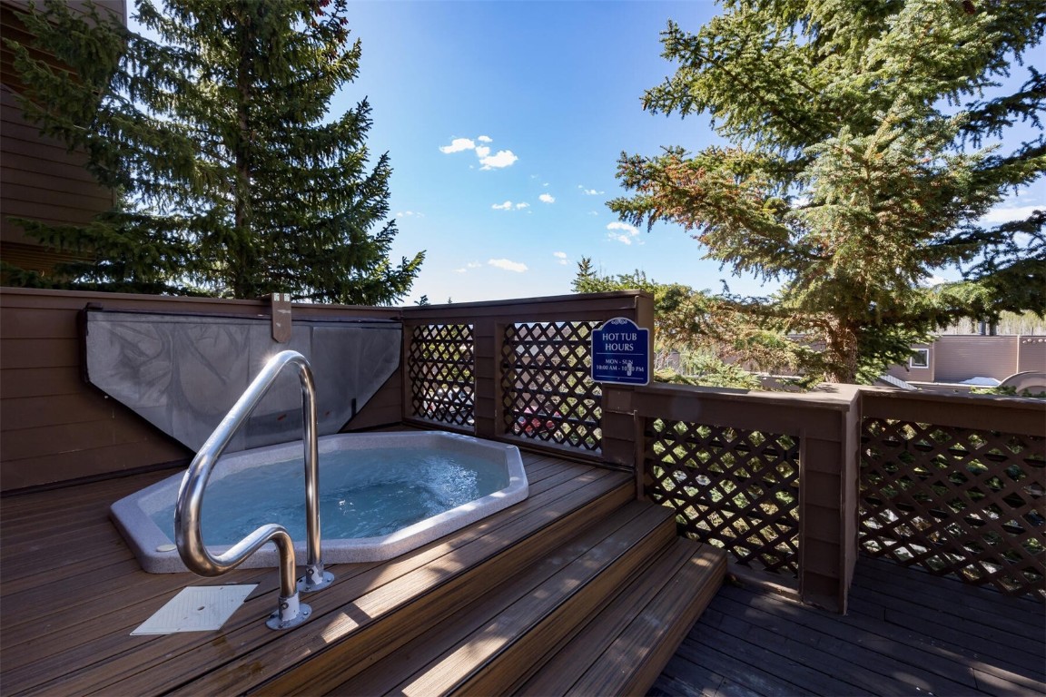 95600 Ryan Gulch Road, Unit 631 Silverthorne, CO 80498 - Photo 35 of 44 a view of balcony with wooden floor and outdoor seating