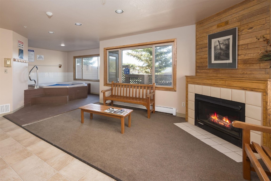 95600 Ryan Gulch Road, Unit 631 Silverthorne, CO 80498 - Photo 36 of 44 a living room with furniture and a fireplace