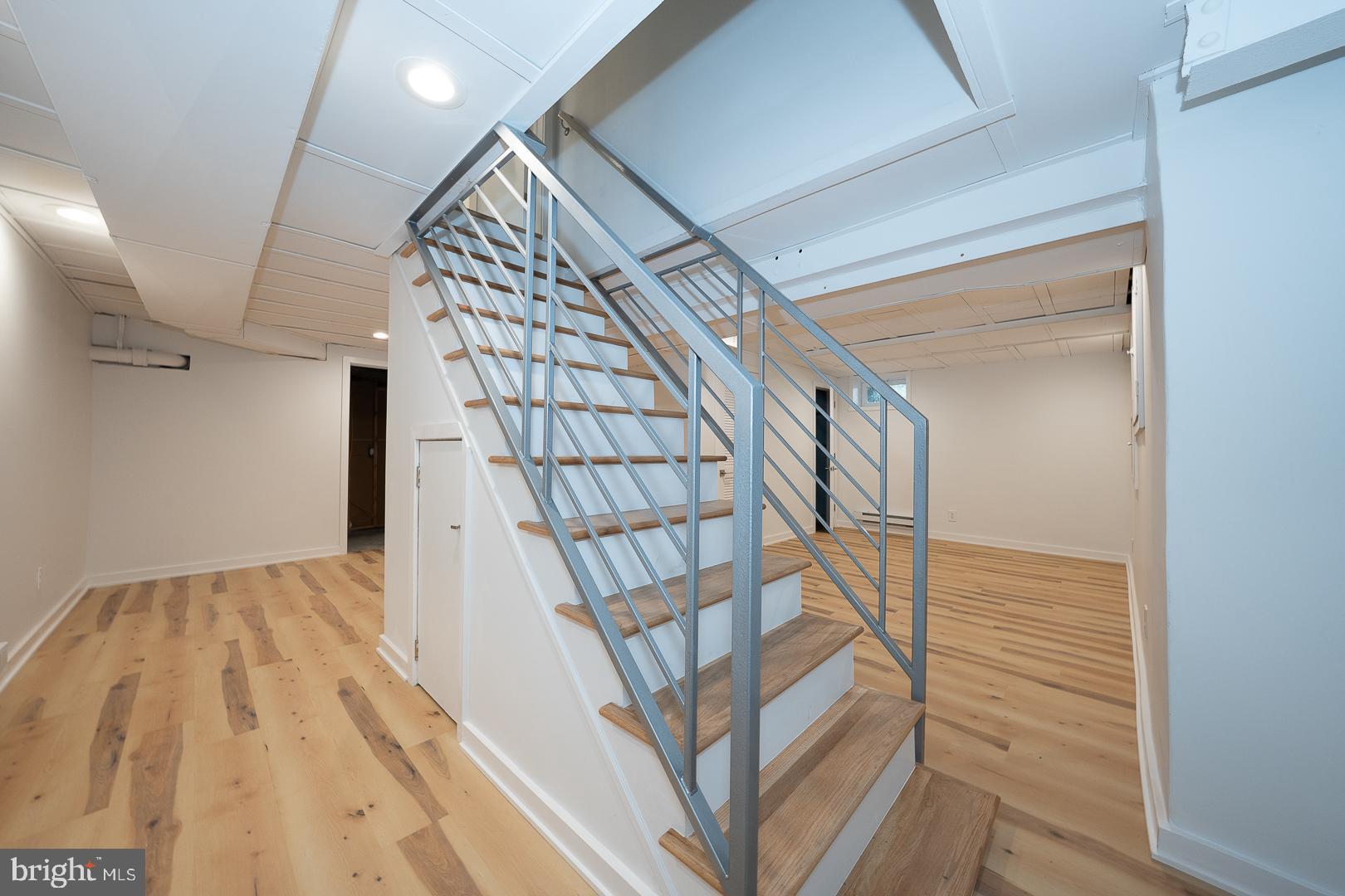 115 David Road Bala Cynwyd, PA 19004 - Photo 44 of 56 New custom Iron banisters and LVP flooring