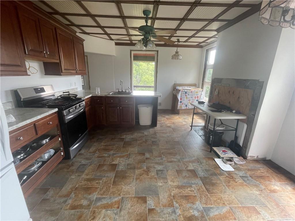 489 Jack Road Vandergrift, PA 15690 - Photo 22 of 46 a kitchen with stainless steel appliances granite countertop a stove a sink and a cabinets