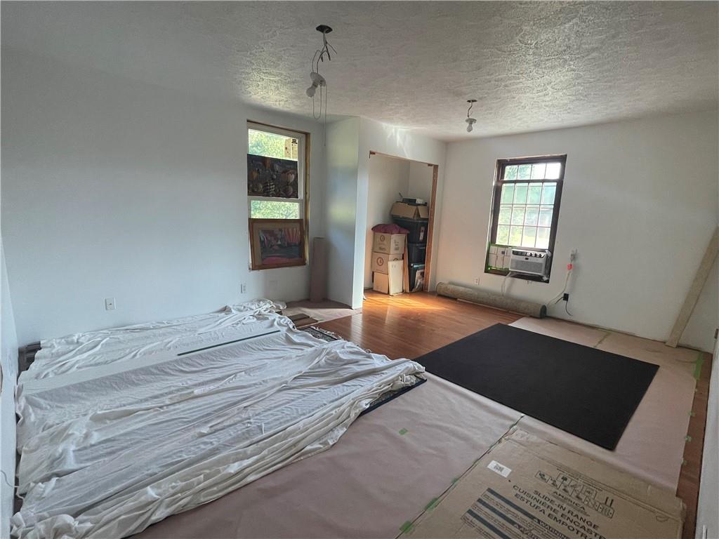 489 Jack Road Vandergrift, PA 15690 - Photo 23 of 46 a bedroom with a bed and a large mirror on the dresser
