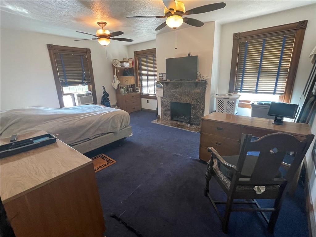 489 Jack Road Vandergrift, PA 15690 - Photo 24 of 46 a bedroom with furniture and a fireplace