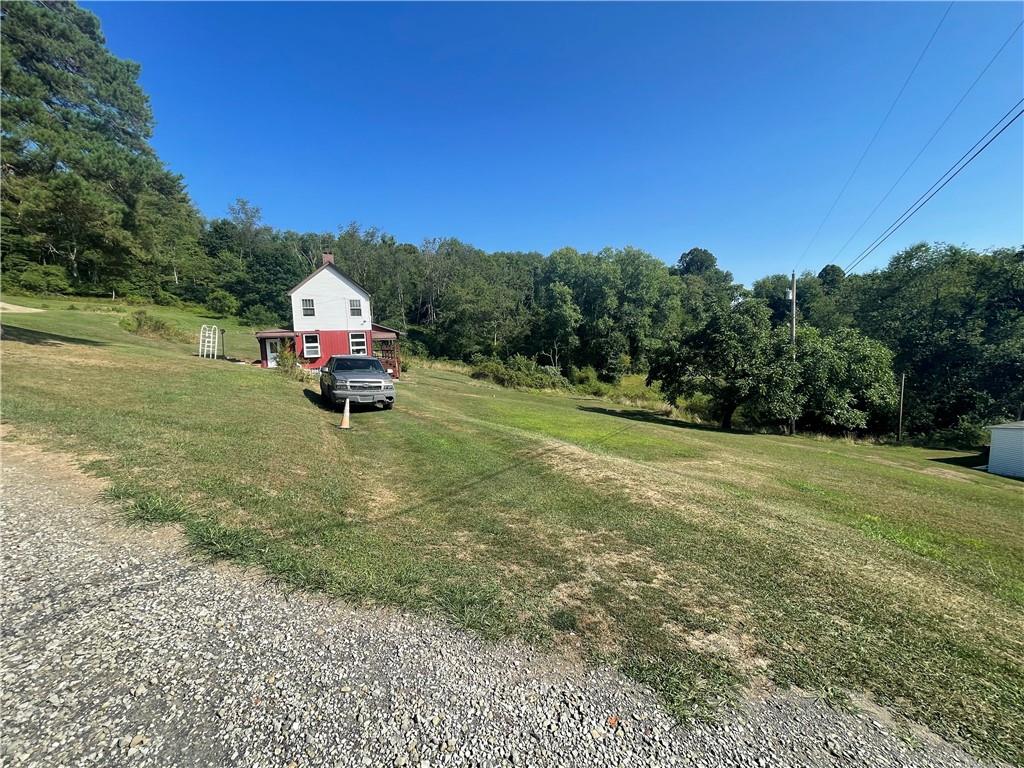 489 Jack Road Vandergrift, PA 15690 - Photo 33 of 46 a view of a fire pit with a car parked in the yard