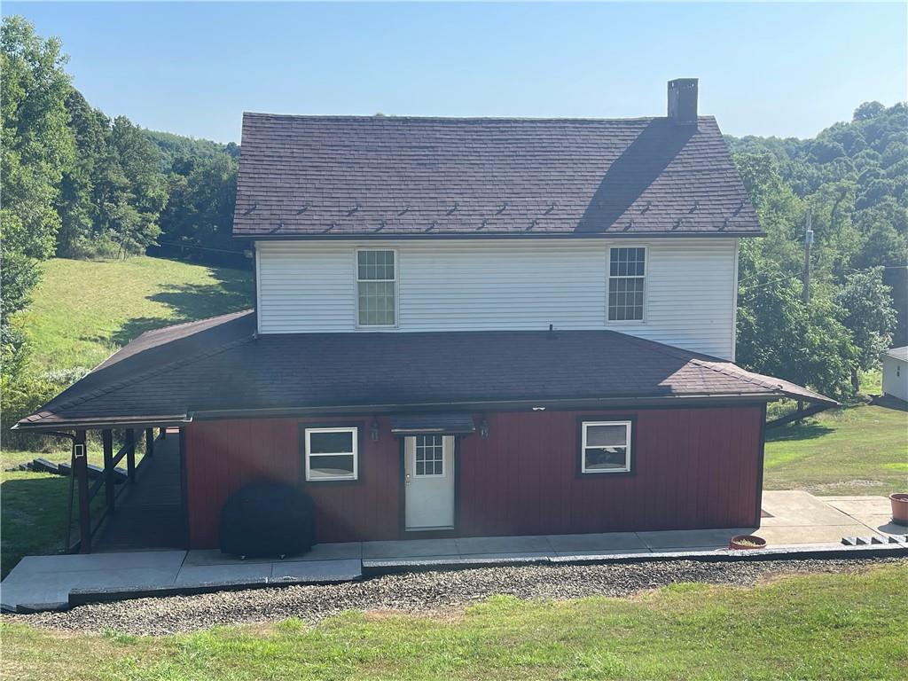 489 Jack Road Vandergrift, PA 15690 - Photo 8 of 46 a front view of house with yard and trees in the background