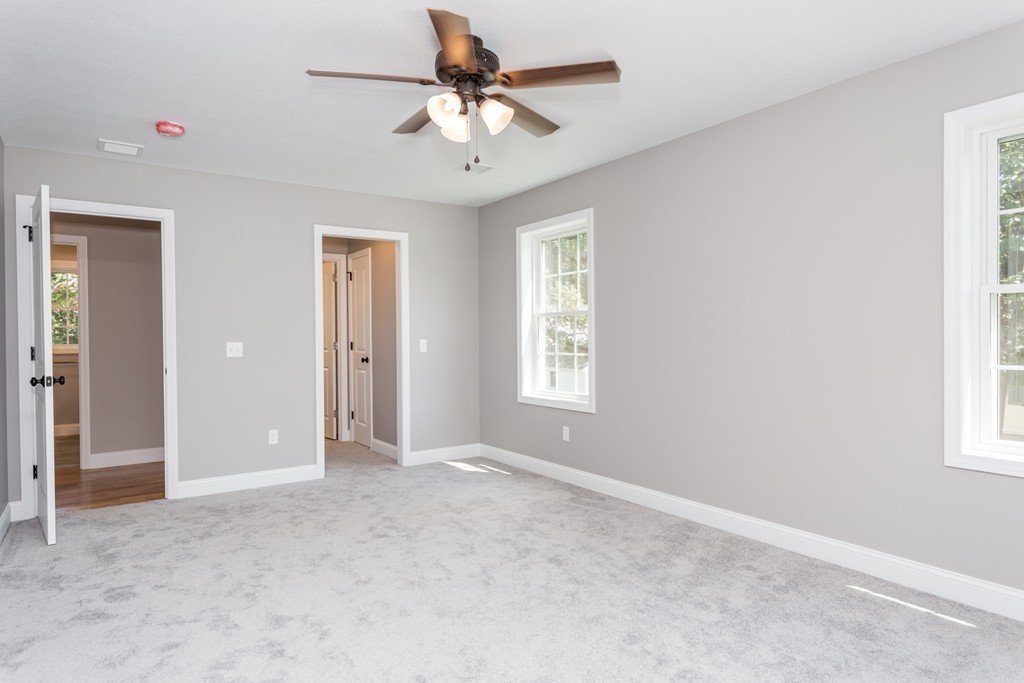 89 Wallace Street Springfield, MA 01119 - Photo 15 of 28 an empty room with windows and fan