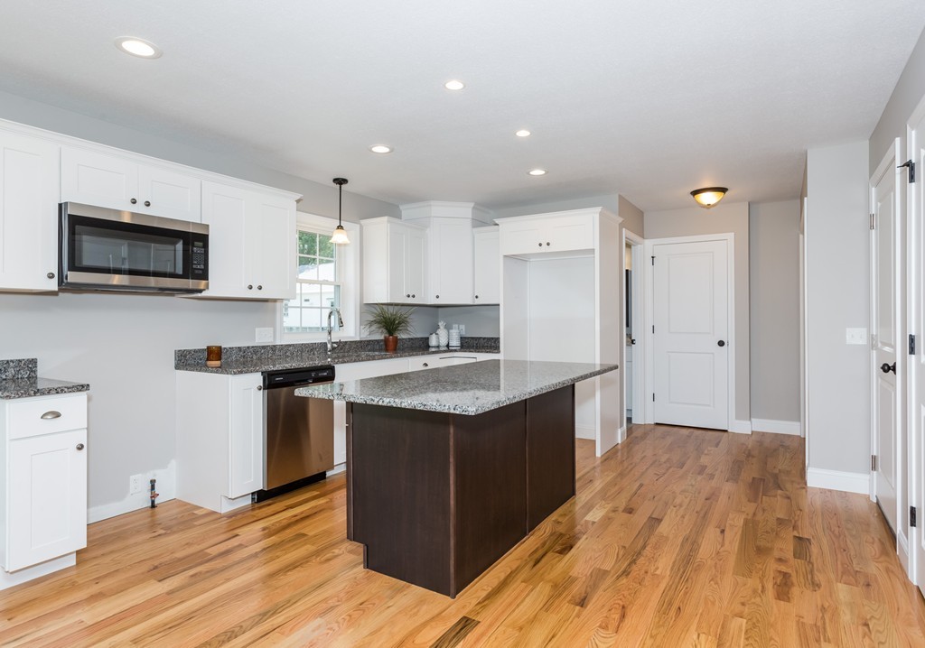 89 Wallace Street Springfield, MA 01119 - Photo 5 of 28 a kitchen with stainless steel appliances granite countertop a sink stove and refrigerator
