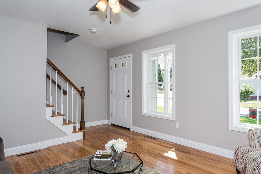 89 Wallace Street Springfield, MA 01119 - Photo 9 of 28 a view of livingroom with furniture wooden floor and front door