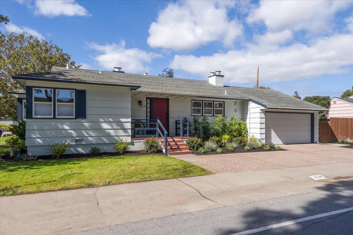 a front view of house with yard