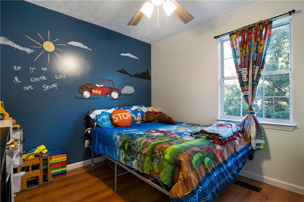 988 Davenport Road Southwest Dalton, GA 30721 - Photo 19 of 29 a bedroom with a bed and window