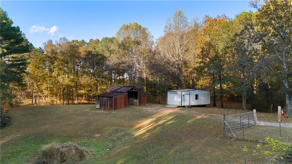 988 Davenport Road Southwest Dalton, GA 30721 - Photo 28 of 29 a view of a house with a yard
