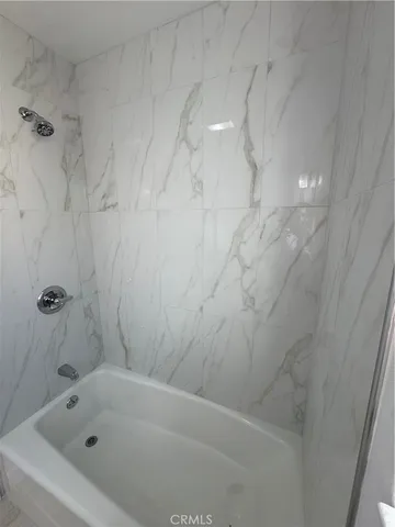 a bathroom with a sink and a window