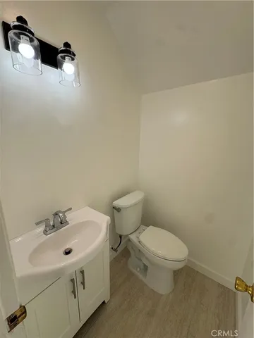 a large kitchen with stainless steel appliances wooden cabinets a oven and a large island