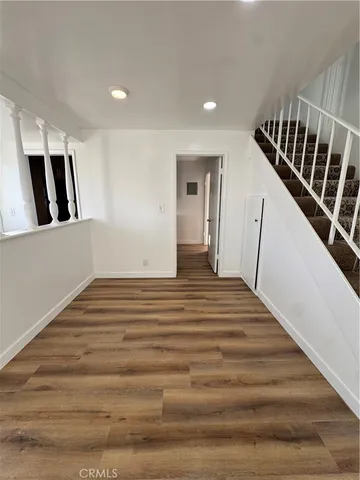 a view of staircase with white walls