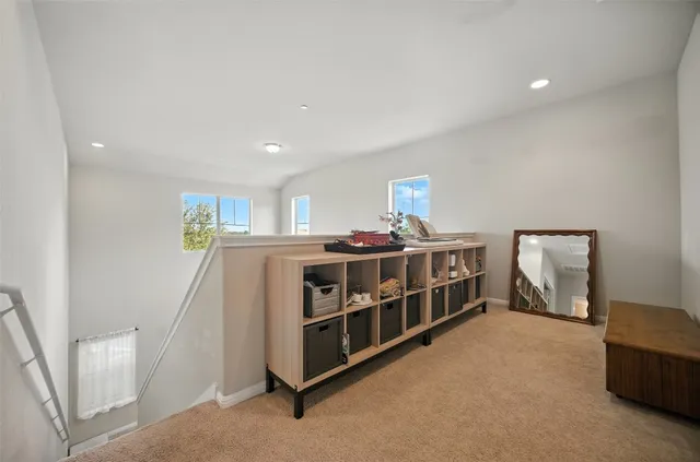 a bedroom with furniture and a window