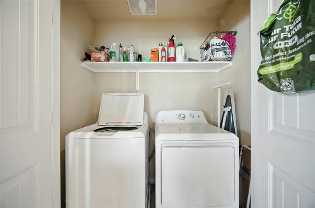 a utility room with dryer and washer