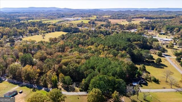 an aerial view of residential house and sandy dunes