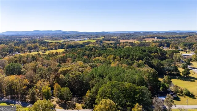 an aerial view of residential house and green space