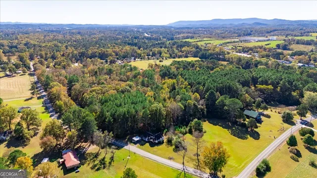 an aerial view of residential houses and outdoor space