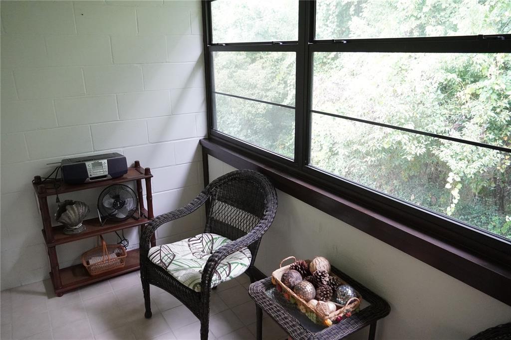2415 Northeast 7th Street, Unit 8 Ocala, FL 34470 - Photo 17 of 25 a living room with furniture and a window