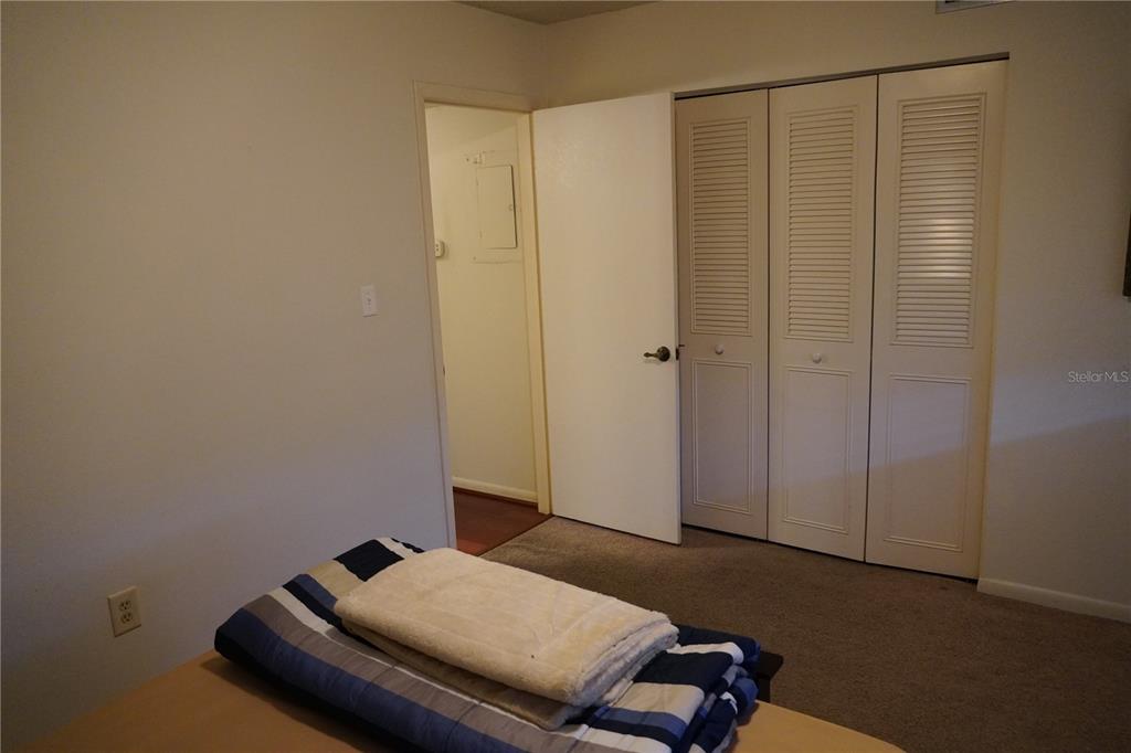 2415 Northeast 7th Street, Unit 8 Ocala, FL 34470 - Photo 19 of 25 a room with a bed