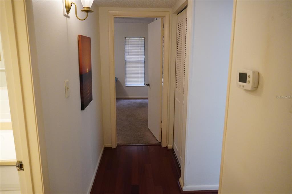 2415 Northeast 7th Street, Unit 8 Ocala, FL 34470 - Photo 22 of 25 a view of a bathroom from a hallway