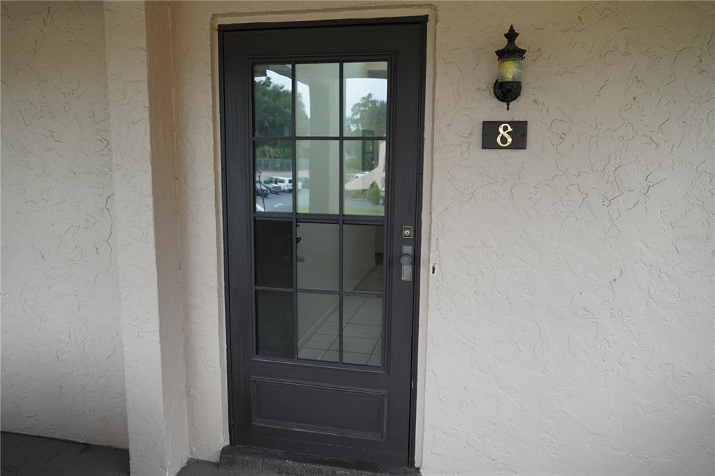 2415 Northeast 7th Street, Unit 8 Ocala, FL 34470 - Photo 3 of 25 a view of hallway with wooden floor